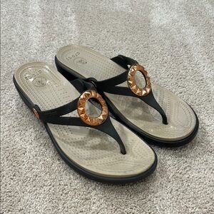 CROCS Black and Gold Sandals with Metallic Accent
